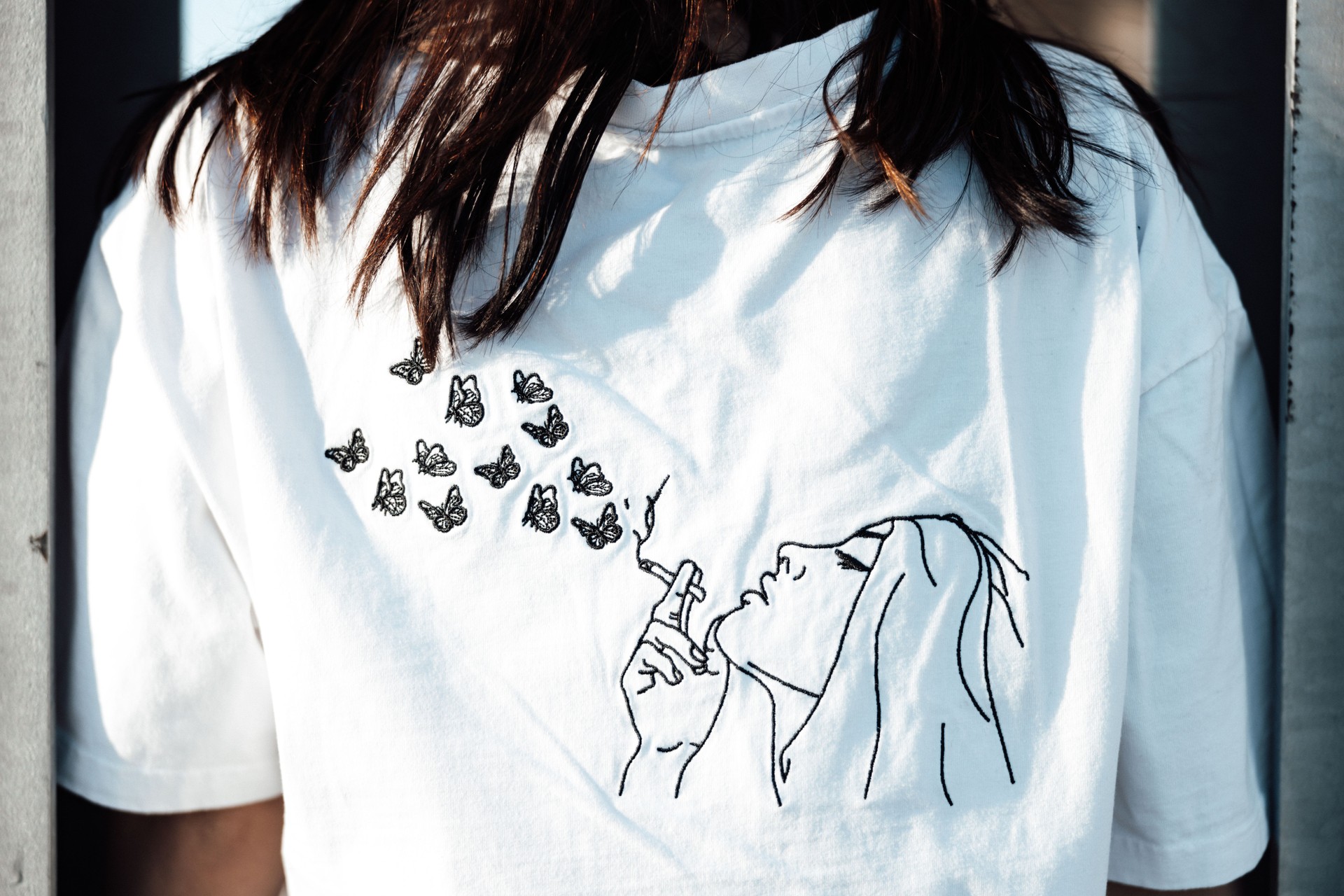 Young Teenage Woman Fashion Designer T-Shirt Detail